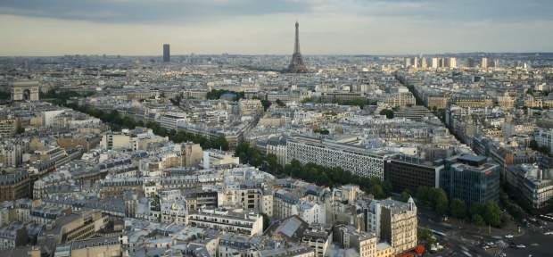 View of Paris' streets, buildings and the Eiffel Tower from up high.