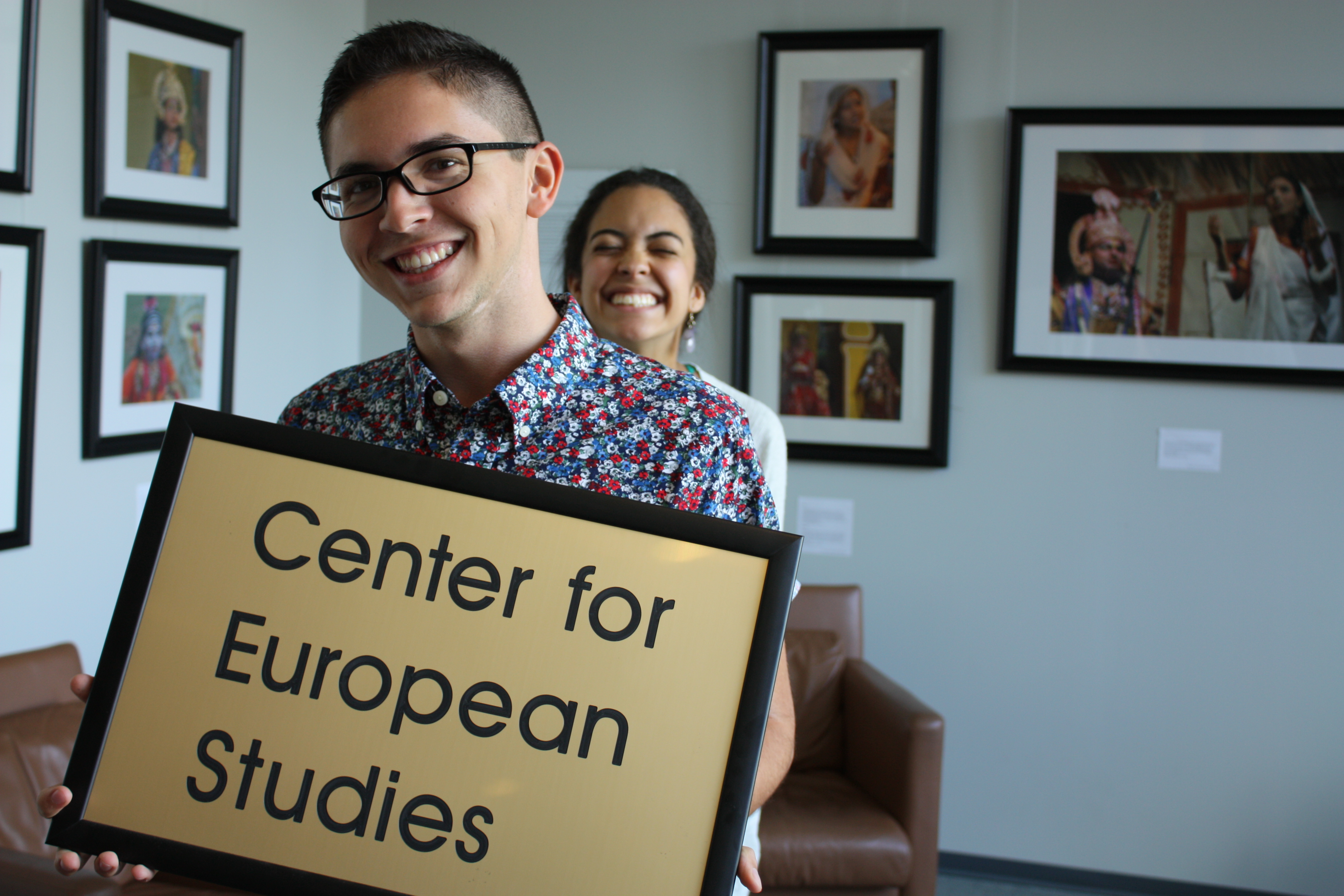 A student holds a picture with the Center for European Studies on it.