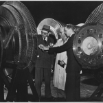 Belgium. Belgian electrical engineers Georges Jean L. Van Antro, left, Georges H. Marchal, center, and Jacques de Schaetzen, inspect the rotor of a 40,000 kilowatt turbine during their visit to the General Electric Company's new $30,000,000 turbine manufacturing building at Schenectady, New York. Discover more through the photograph. Wikimedia Commons, U.S. National Archive Series 